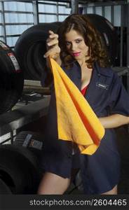 Sexy young woman working in tire shop
