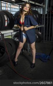 Sexy young woman working in tire shop