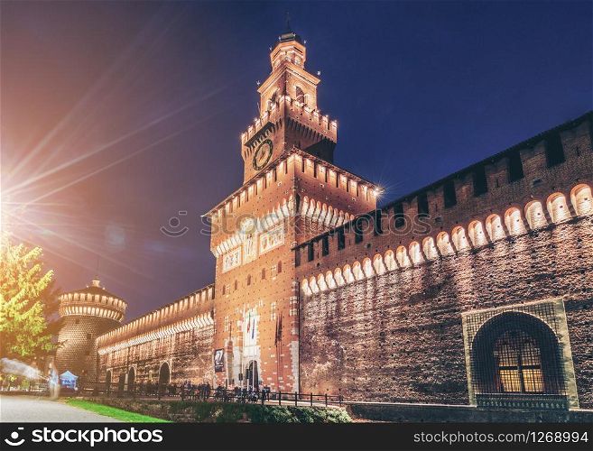 Sforza Castle (Castello Sforzesco) at night in Milan, Italy. The castle was built in the 15th century by Sforza, Duke of Milan. It is the main travel destination for tourist visiting Milan, Italy.