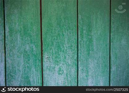 Shabby and very old wooden fence - cracked paint.. Old background - texture
