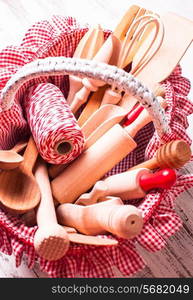 Shabby chic rustic basket with wooden kitchen utensils