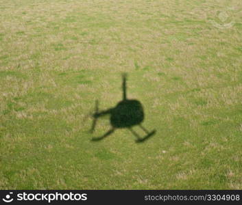 Shadow of a Helicopter on a green meadow