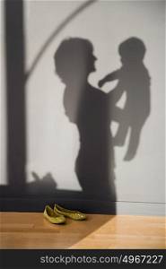 shadow of a woman holding a baby