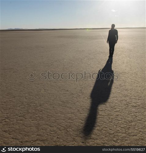 Shadow of a woman on Erg Chegaga Dunes in Sahara Desert, Guelmim-Es Semara, Morocco