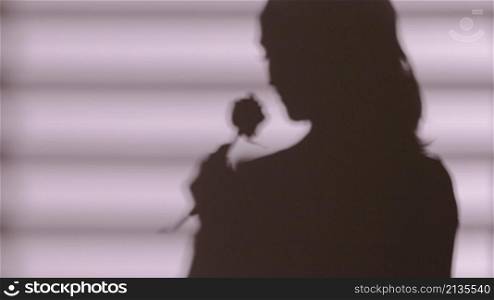 shadow woman holding rose