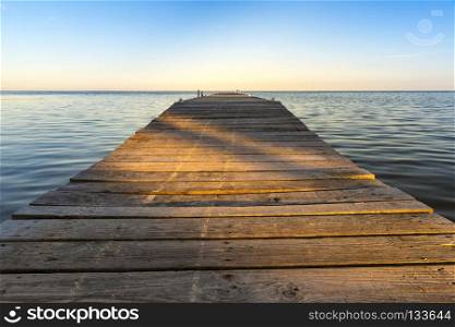 Shadows On Jetty. Shadows cut across wooden jetty at sunset
