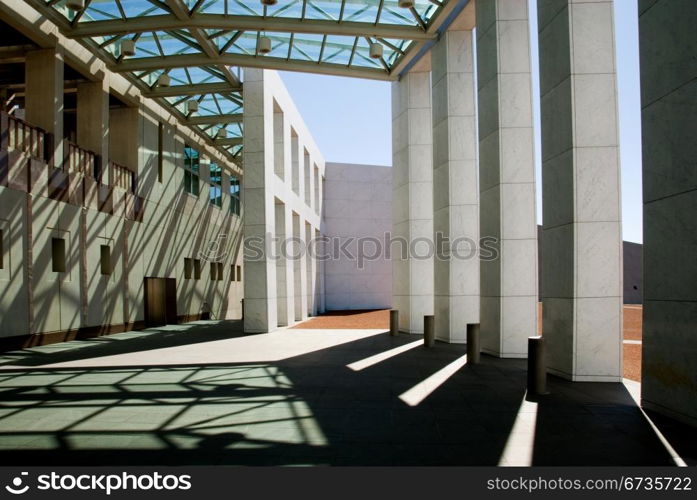 Shadows on the wall and pavement outside the main entrance to Parliament House, Canberra, Australia