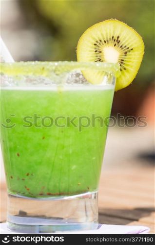 Shake refreshing and natural kiwi on a terrace