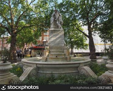Shakespeare statue in London. LONDON, UK - JUNE 10, 2015: Statue of William Shakespeare built in 1874 in Leicester Square