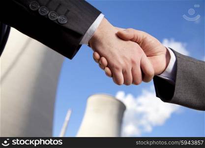 Shaking hands at power plant