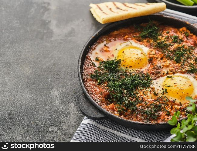 Shakshuka, Fried Eggs in Tomato Sauce. Traditional Mediterranean Fried Eggs. Israeli cuisine