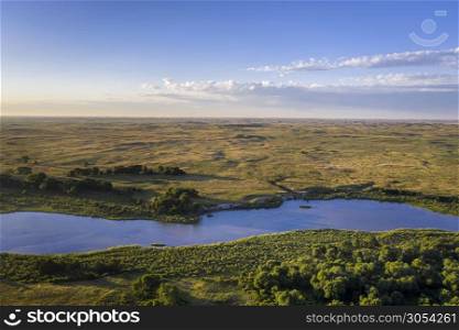 shallow and wide Dismal RIver flowing through Nebraska Sandhills at Nebraska National Forest, aerial view of summer scenery