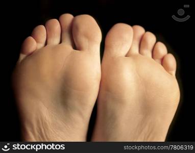 Shallow depth-of-field image of the bottom of a females feet.