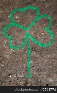 Shamrock hand drawn with crayon on concrete