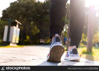 Shanghai China, November 3, 2017 : close up of man shoe while walking in the park, walk for life concept