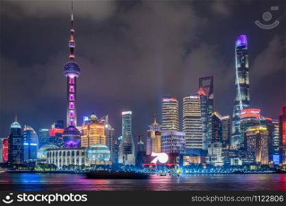 SHANGHAI, CHINA - OCTOBER 12, 2019: Cityscape of Shanghai at night. Panoramic view of Pudong&rsquo;s skyline from the Bund. Located in The Bund (Waitan). One of the most famous tourist destinations in Shanghai.