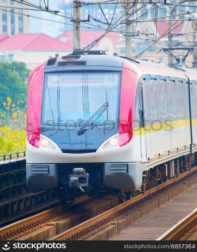 Shanghai metro train on a railroad. China