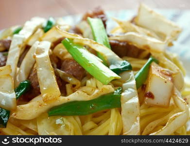 Shanghai Noodles - style fried noodles with meats and mixed vegetables