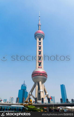 Shanghai Oriental pearl TV tower building in Shanghai Downtown skyline, China. Financial district and business centers in smart city in Asia. Skyscraper and high-rise buildings with blue sky