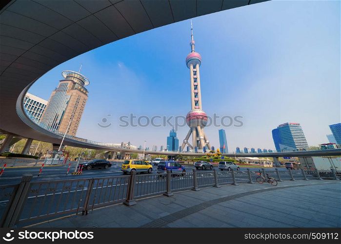 Shanghai Oriental pearl TV tower building in Shanghai Downtown skyline, China. Financial district and business centers in smart city in Asia. Skyscraper and high-rise buildings with blue sky