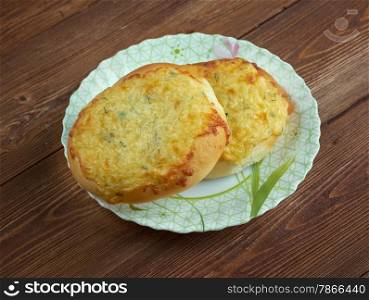 shangi- patties with cottage cheese Russian pastry.on a wood background