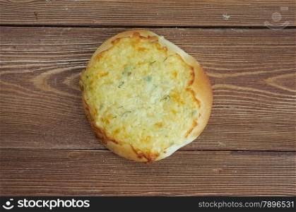 shangi- patties with cottage cheese Russian pastry.on a wood background
