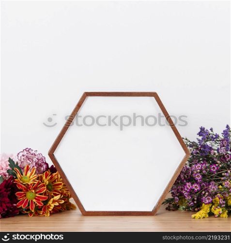 shaped frame picture among flowers