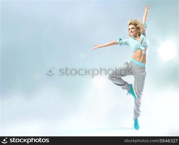 Shapely young dancer practicing trhe choreography