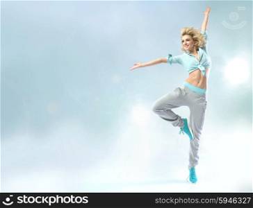 Shapely young dancer practicing trhe choreography
