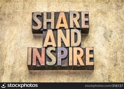 share and inspire word abstract in vintage letterpress wood type against textured bark paper