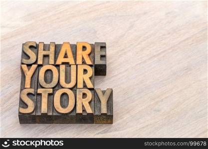 share your story word abstract in vintage letterpress wood type against grained wood with a copy space