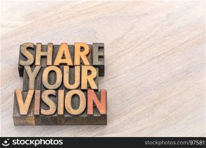 share your vision word abstract in vintage letterpress wood type against grained wood with a copy space