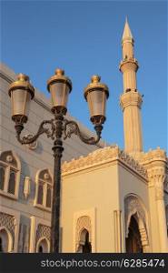 SHARJAH, UAE - NOVEMBER 6, 2013: Mosque at sunrise in Sharjah. It is the most industrialized emirate in UAE.