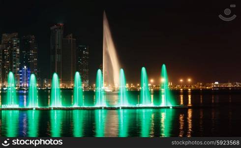 SHARJAH, UAE - OCTOBER 29, 2013: Musical fountain show. The Sharjah Fountain is one of the biggest fountains in the region.