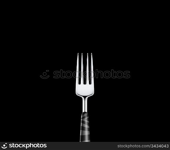 Sharp metal fork on black background