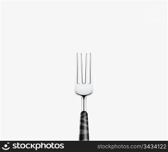 Sharp metal fork on white background