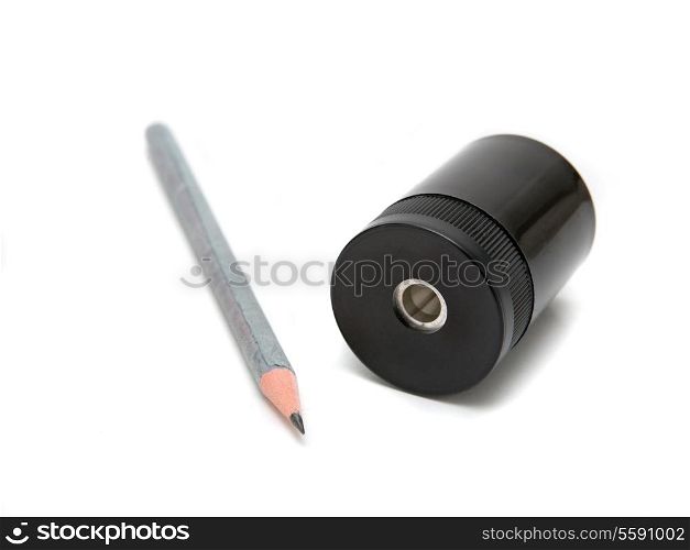 Sharpener and pen on a white background