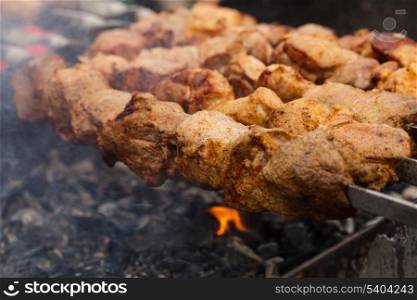 Shashlik on skewers roast over burning coals