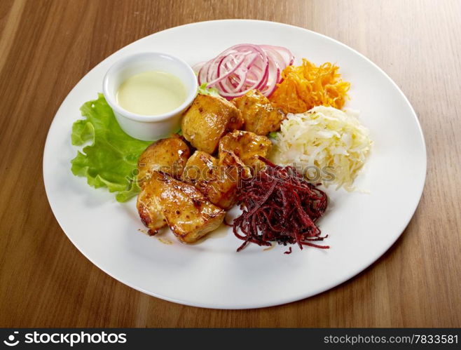 Shashlik (shish kebab) .chicken making roasted with vegetable closeup