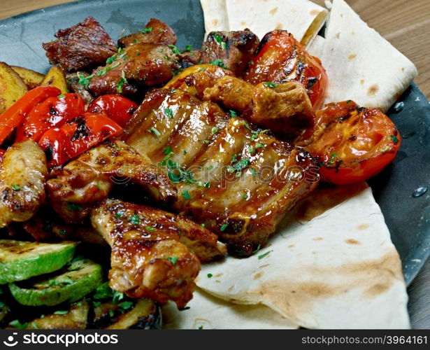 Shashlik - shish kebab. Various types mat roasted with vegetable closeup