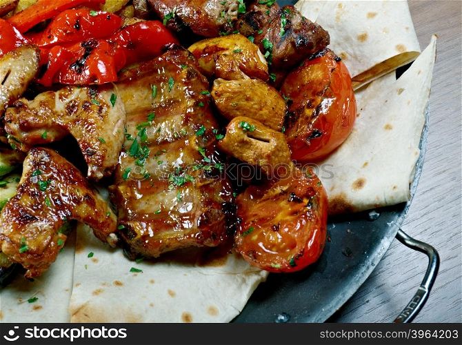 Shashlik - shish kebab. Various types mat roasted with vegetable closeup
