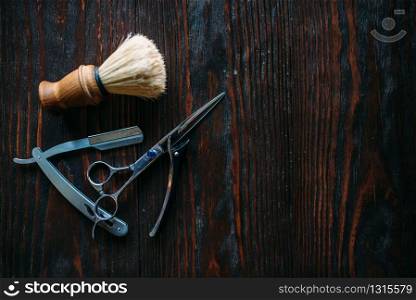 Shaving and barber shop equipment on wooden background, closeup. Shaving and barber equipment on wooden background