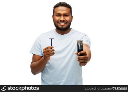 shaving, grooming and people concept - smiling young african american man choosing between manual razor blade and trimmer over white background. smiling african man with razor blade and trimmer