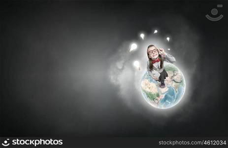 She explores this wold. Wideangle picture of funny schoolgirl with paper plane. Elements of this image are furnished by NASA