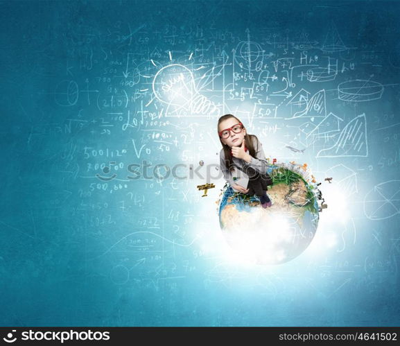 She explores this wold. Wideangle picture of funny schoolgirl with paper plane. Elements of this image are furnished by NASA