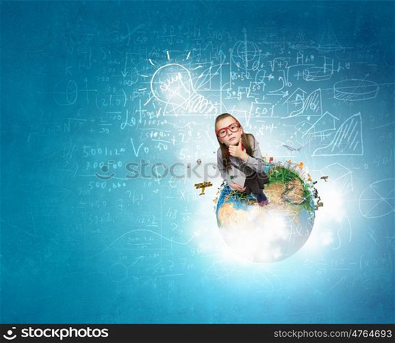 She explores this wold. Wideangle picture of funny schoolgirl with paper plane. Elements of this image are furnished by NASA