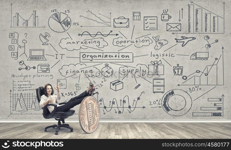 She has big plan for big income. Young confident businesswoman sitting in chair with legs on euro coin and showing ok gesture