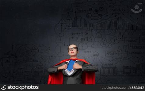 She is generator of super ideas. Businesswoman wearing red cape and opening her shirt like superhero