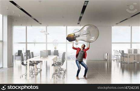 She is got great idea. Elegant businesswoman in modern office interior against window panoramic view