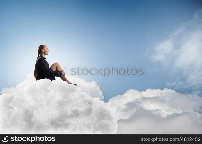 She is in dispair and isolation. Thoughtful young businesswoman sitting alone on cloud high in sky